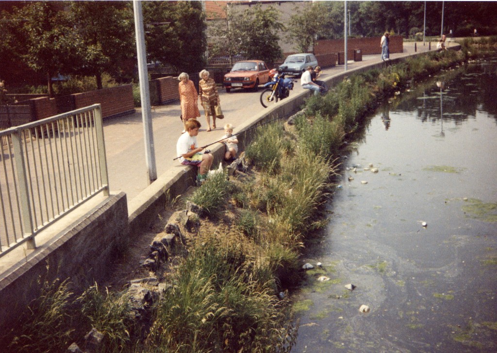 Anglers fishing from a canal bank